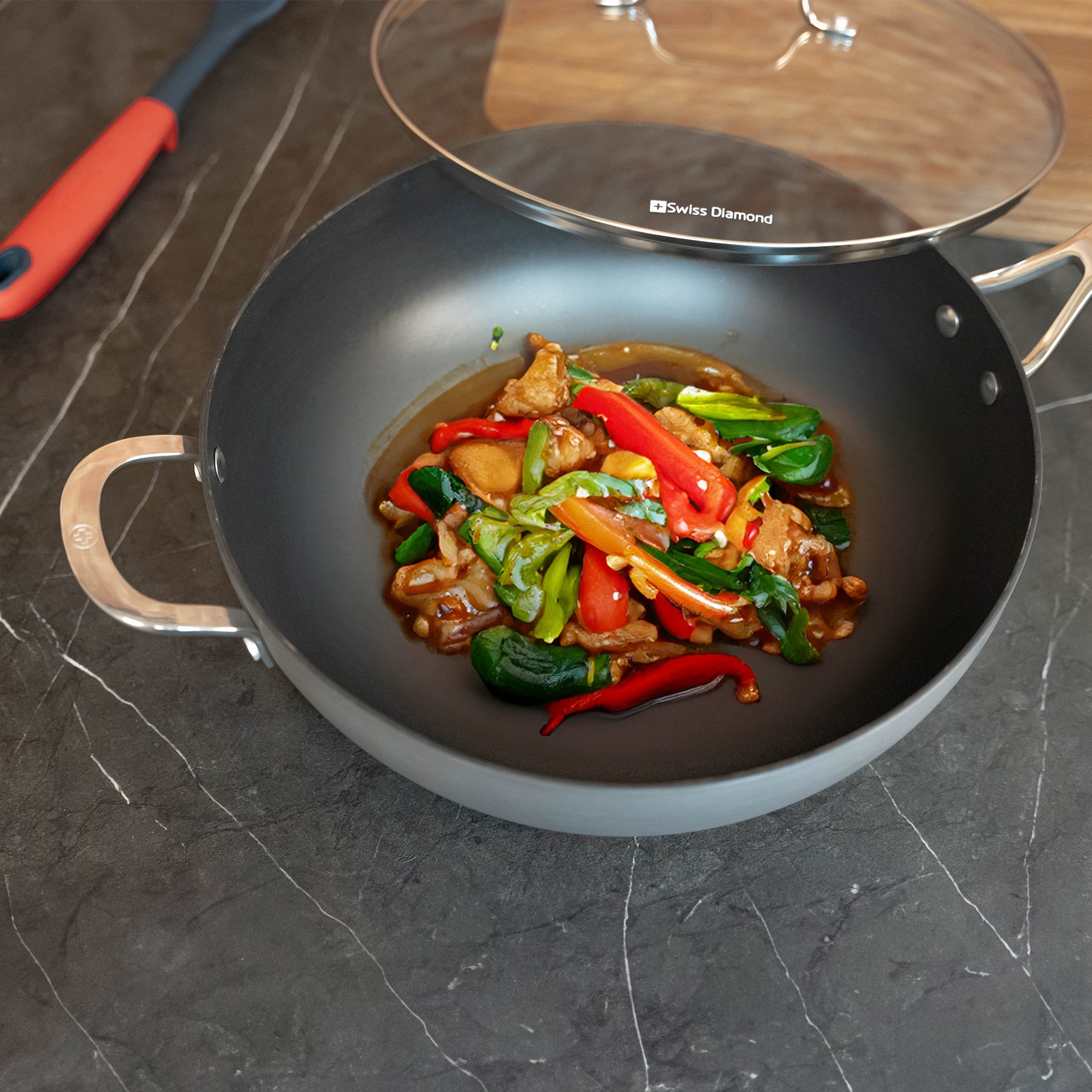 Hard Anodised 12.5" Wok with Glass Lid in use with food inside pan
