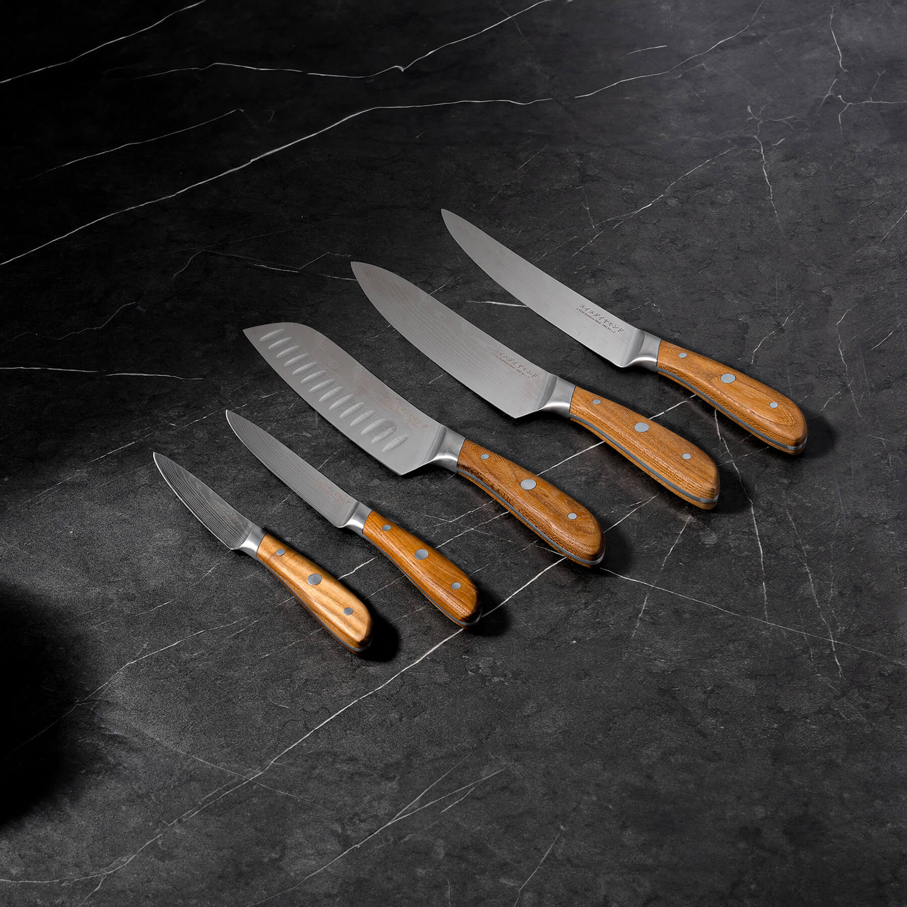 Damascus 5-Piece Knife Set on black marble kitchen counter