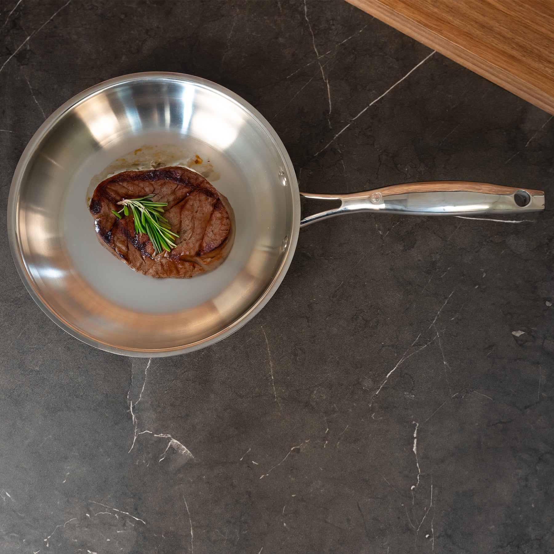 Premium Steel 8" Fry Pan - Induction in use with meat on surface on kitchen counter