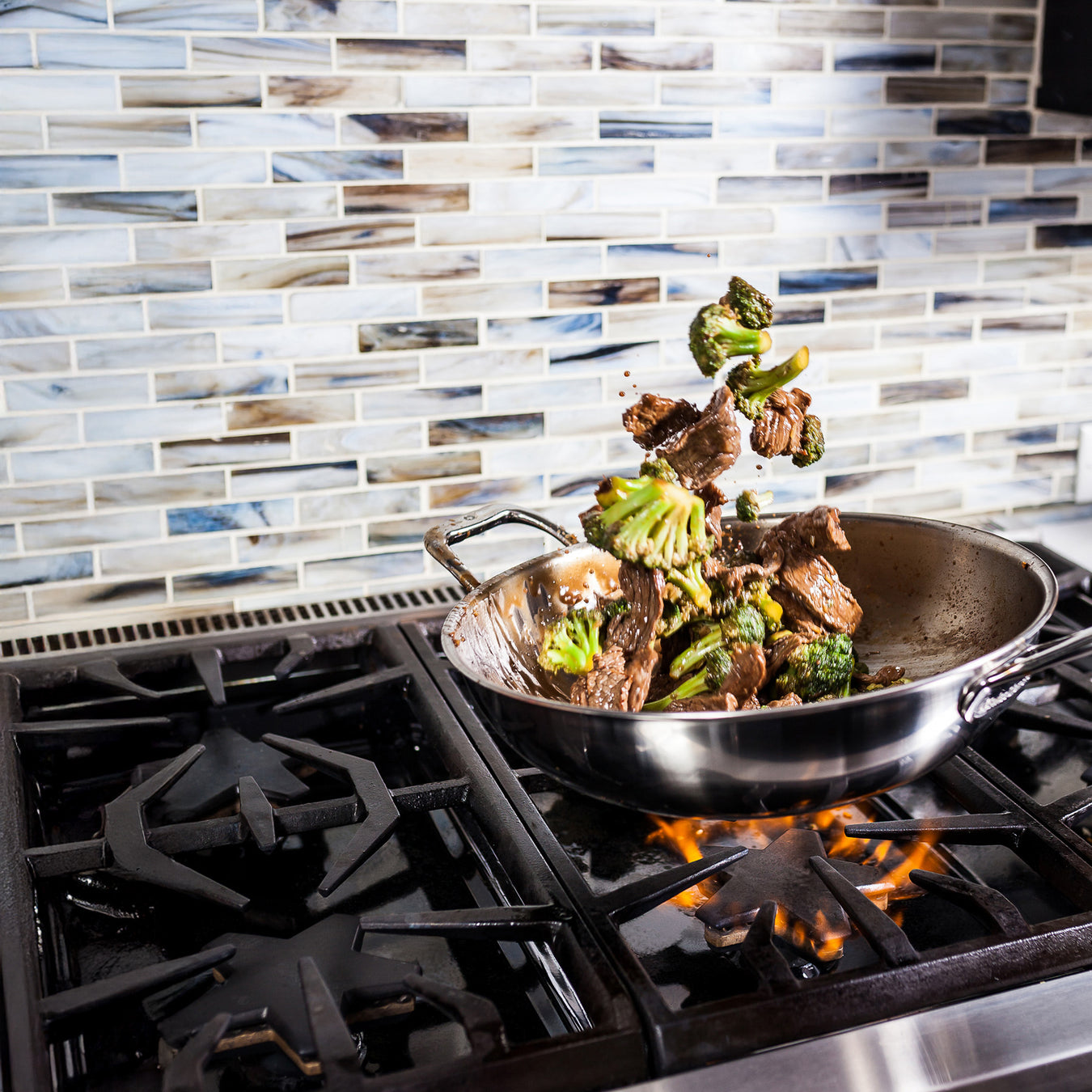 Premium Clad with food inside on gas stove top