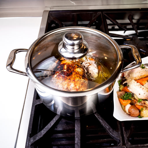 Premium Clad 6.3 qt Dutch Oven with Glass Lid - Induction in use on kitchen gas stove top