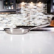 Premium Clad Fry Pan - Induction in use on kitchen counter - side view