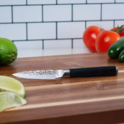 4" Hammered Paring Knife on cutting board with vegetables