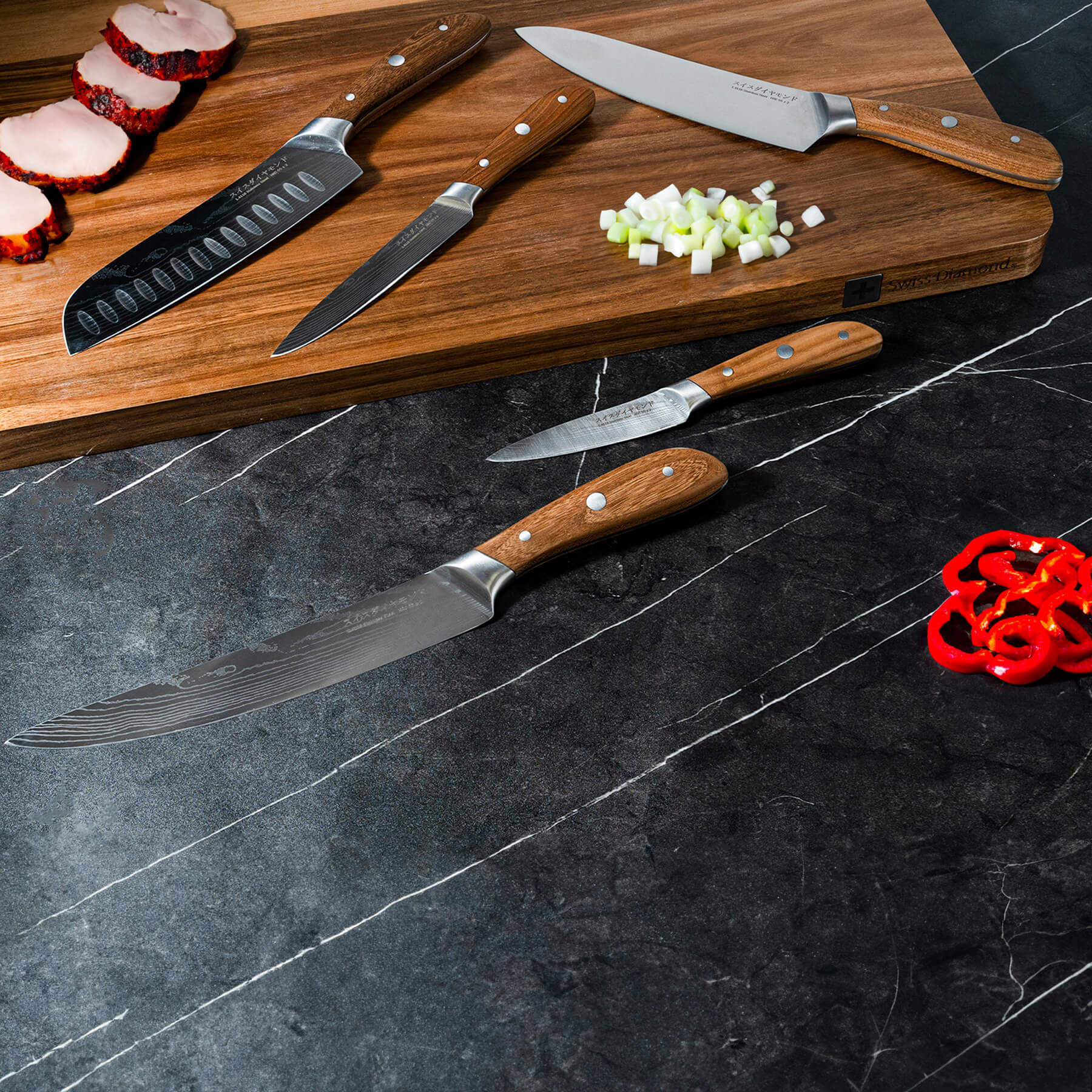 Damascus 5-Piece Knife Set on wooden cutting board