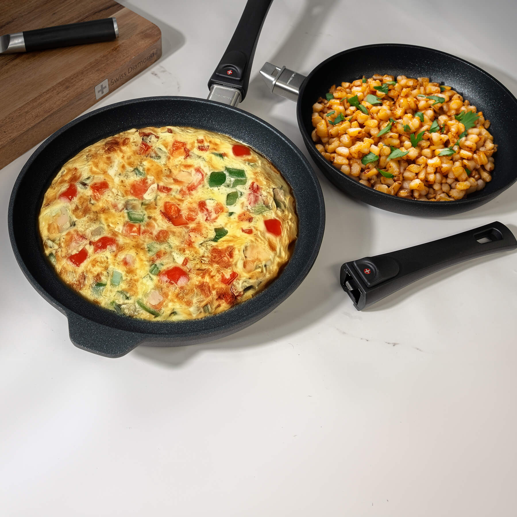 XD Nonstick 2-Piece Set - Duo Fry Pans with Detachable Handle - Induction in use with food inside on kitchen counter