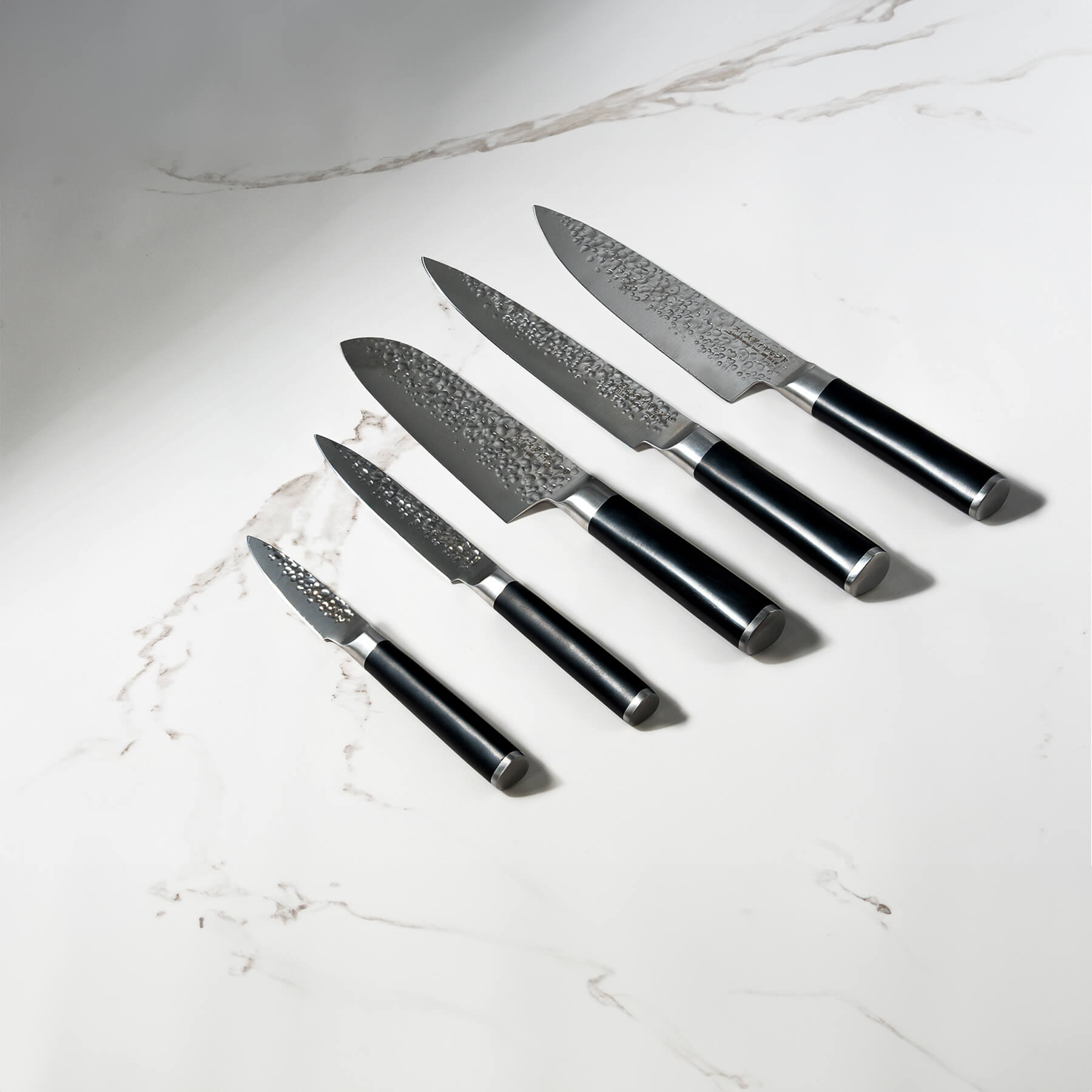Hammered 5-Piece Knife Set on white marble kitchen counter