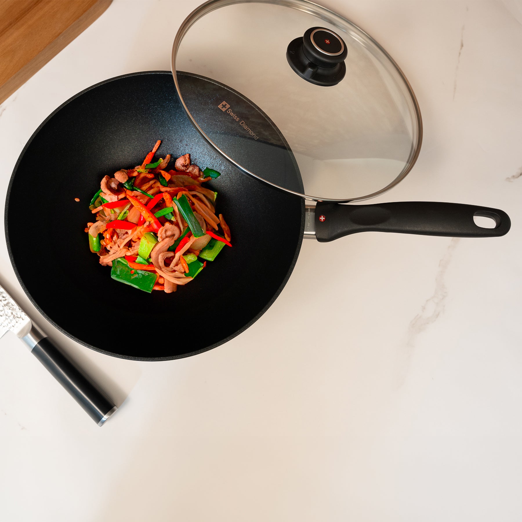 XD Nonstick Wok with Glass Lid in use with food inside