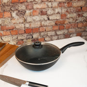 XD Nonstick Wok with Glass Lid in use on kitchen counter