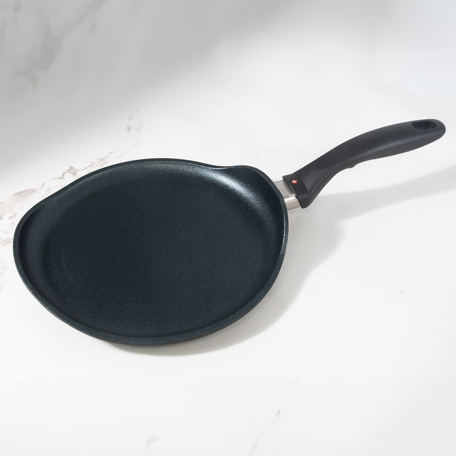 XD Nonstick Crepe Pan - Induction on a marble kitchen counter