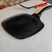 XD Nonstick 11" x 11" Square Griddle in use on marble counter