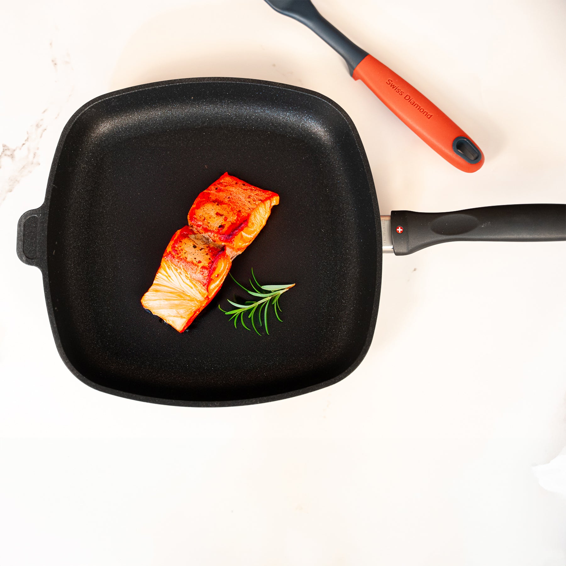 XD Nonstick 11" x 11" Square Fry Pan in use with cooked salmon on surface