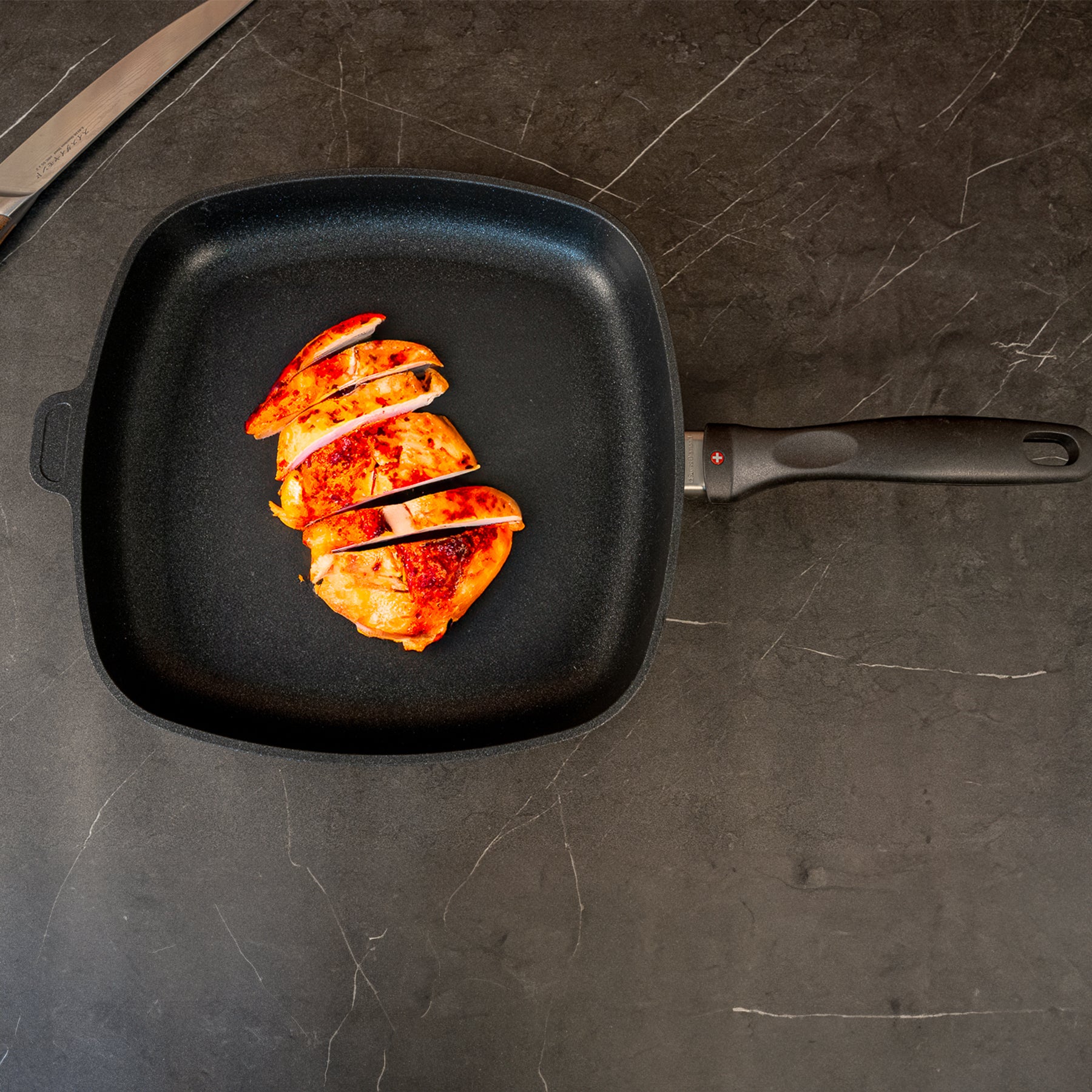 XD Nonstick 11" x 11" Square Fry Pan - Induction in use with cooked chicken on surface