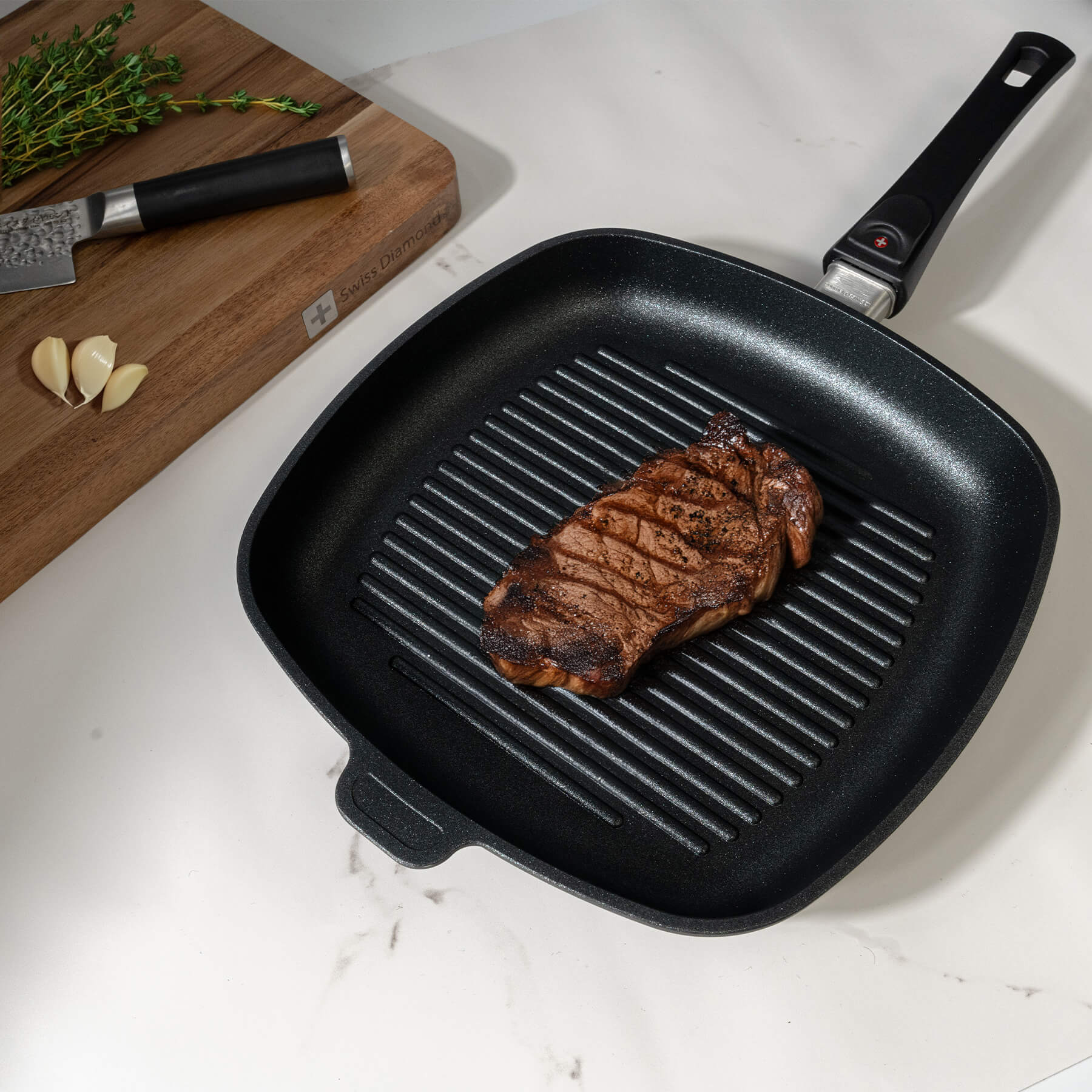 XD Nonstick 11" x 11" Square Grill Pan with Detachable Handle - Induction in use with food in pan on kitchen counter