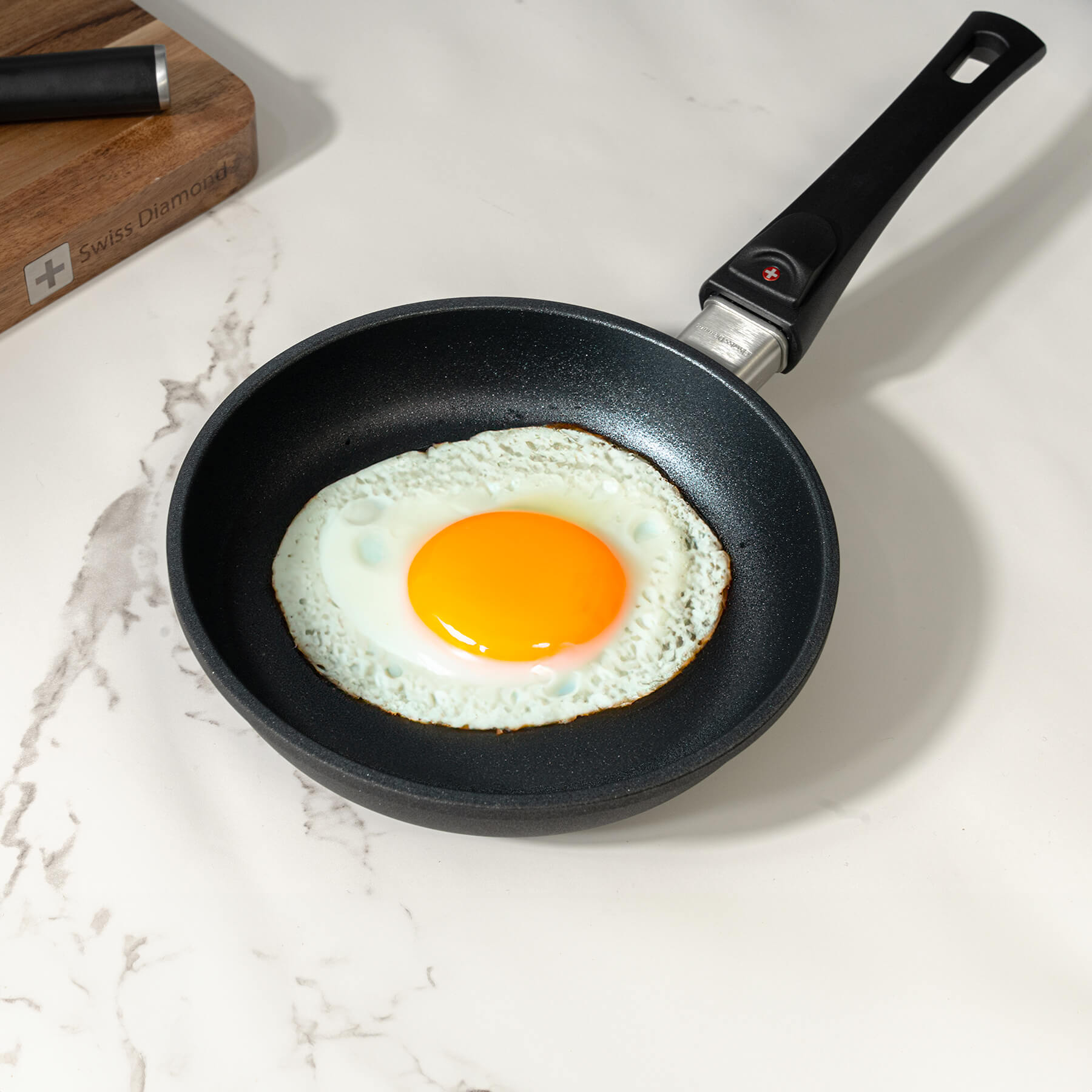 XD Nonstick 8" Fry Pan with Detachable Handle - Induction in use wit fried sunny side egg inside on kitchen counter