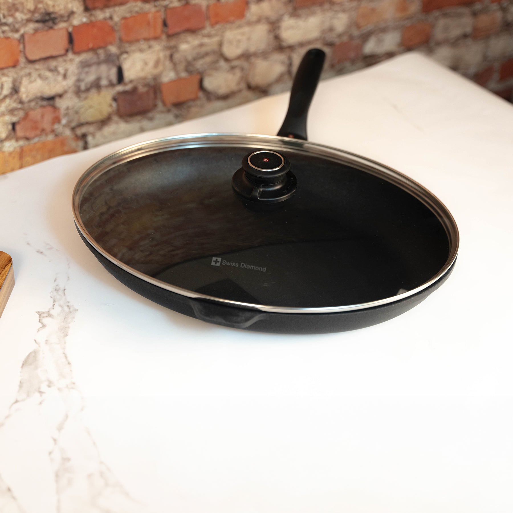 XD Nonstick Oval Fish Pan with Glass Lid in use on kitchen counter