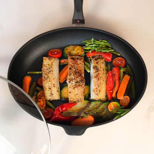 XD Nonstick Oval Fish Pan with Glass Lid with food