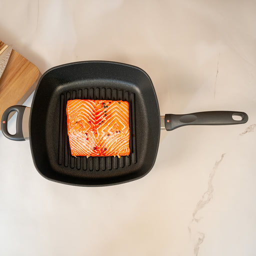 XD Nonstick 11" x 11" Deep Square Grill Pan in use with salmon on surface