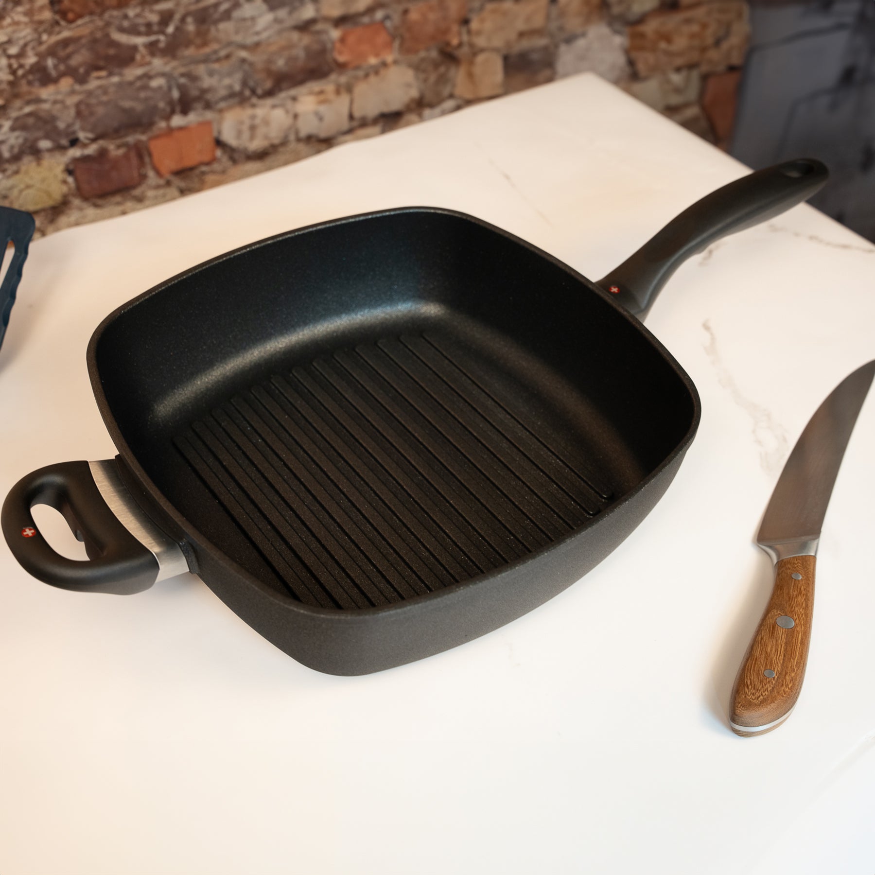XD Nonstick 11" x 11" Deep Square Grill Pan - Induction in use on marble countertop