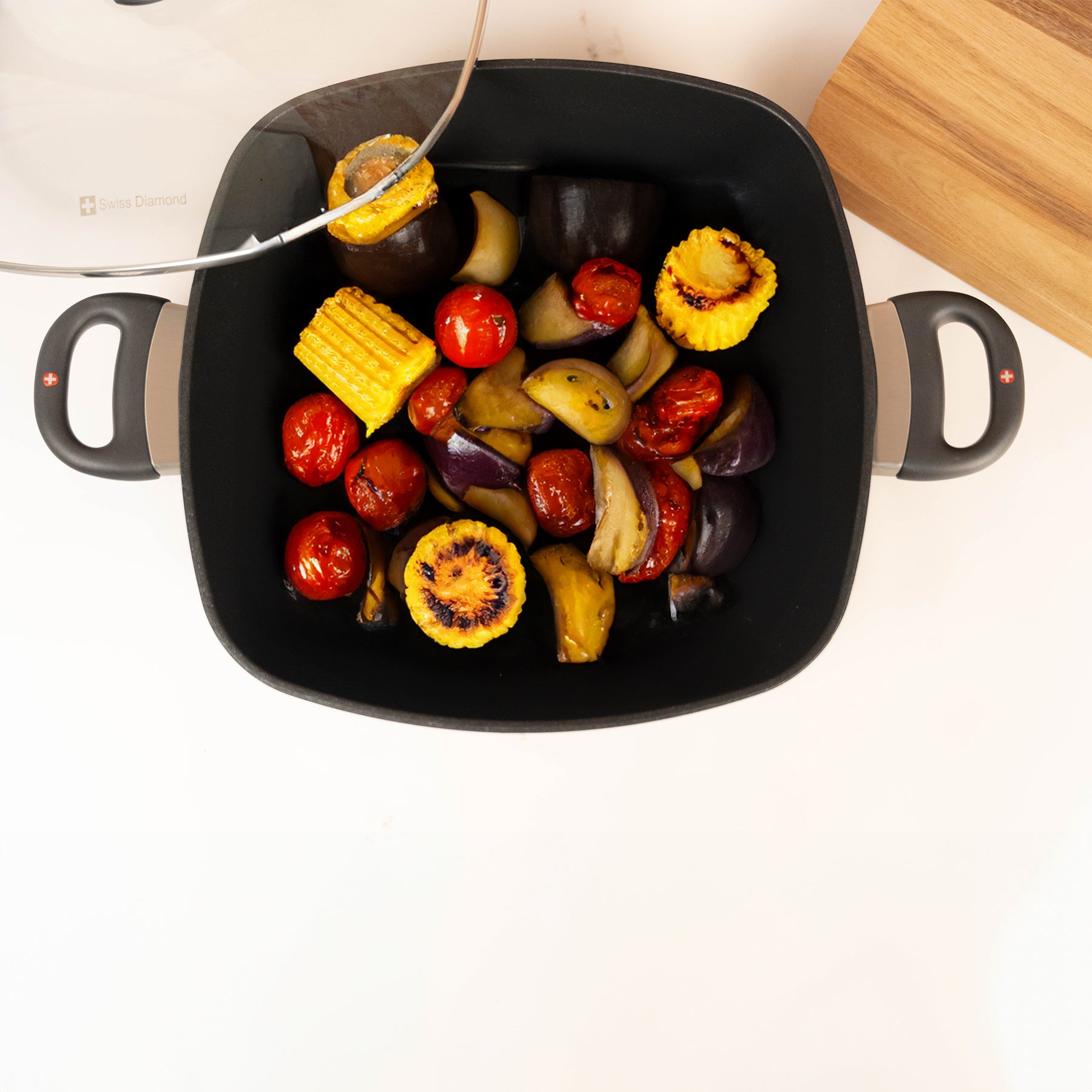 XD Nonstick 5 qt Square Casserole with Glass Lid in use with food inside