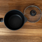 XD Nonstick Saucepan with Glass Lid - Induction on cutting board top view