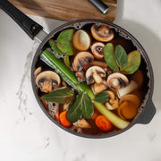 XD Nonstick 3.2 qt Saute Pan with Detachable Handle - Induction in use with food in side on kitchen counter