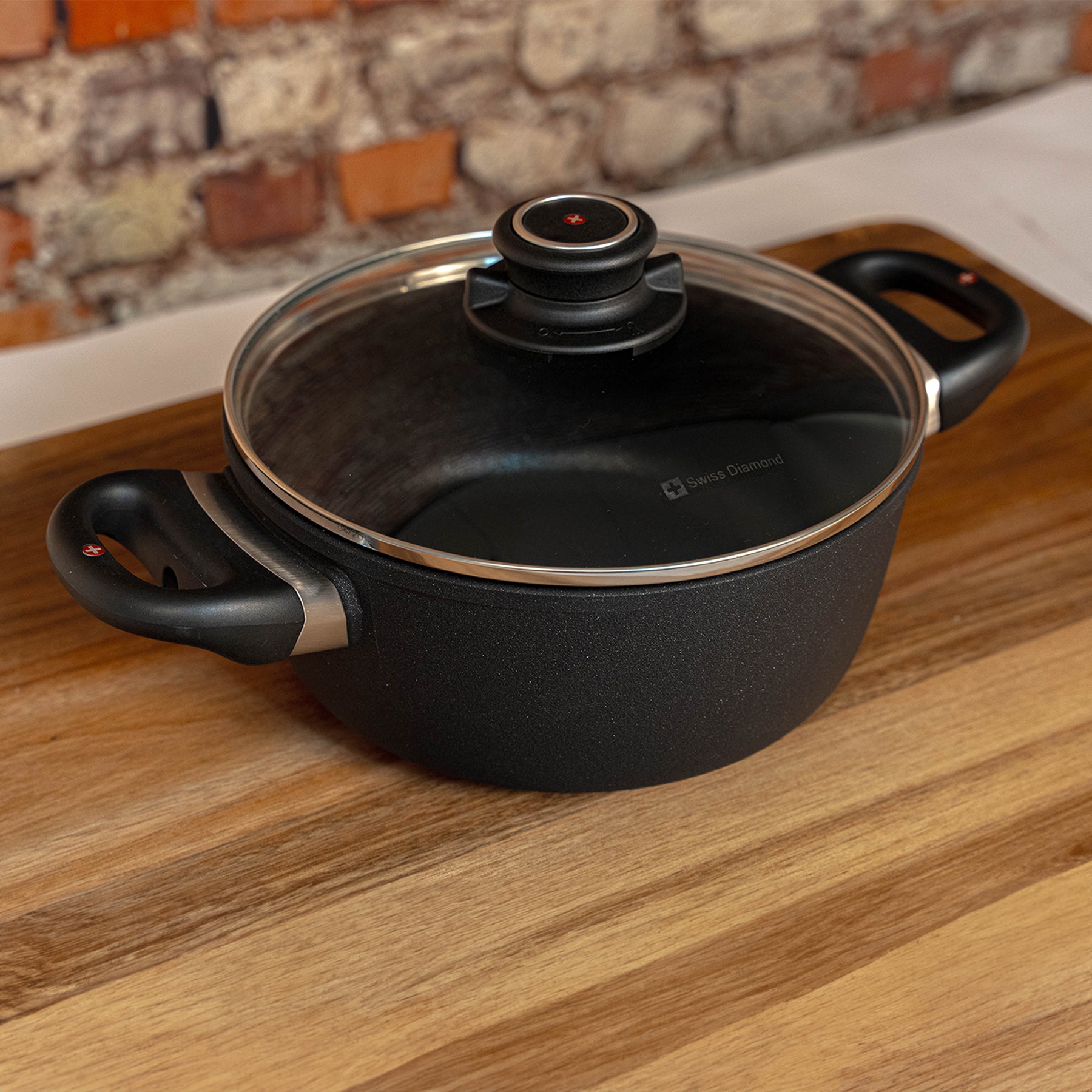 XD Nonstick Casserole with Glass Lid side view on a cutting board
