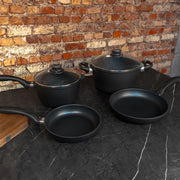 XD Nonstick 6-Piece Set - Fry Pan, Saucepan & Soup Pot - Induction side angled view on black marble counter top