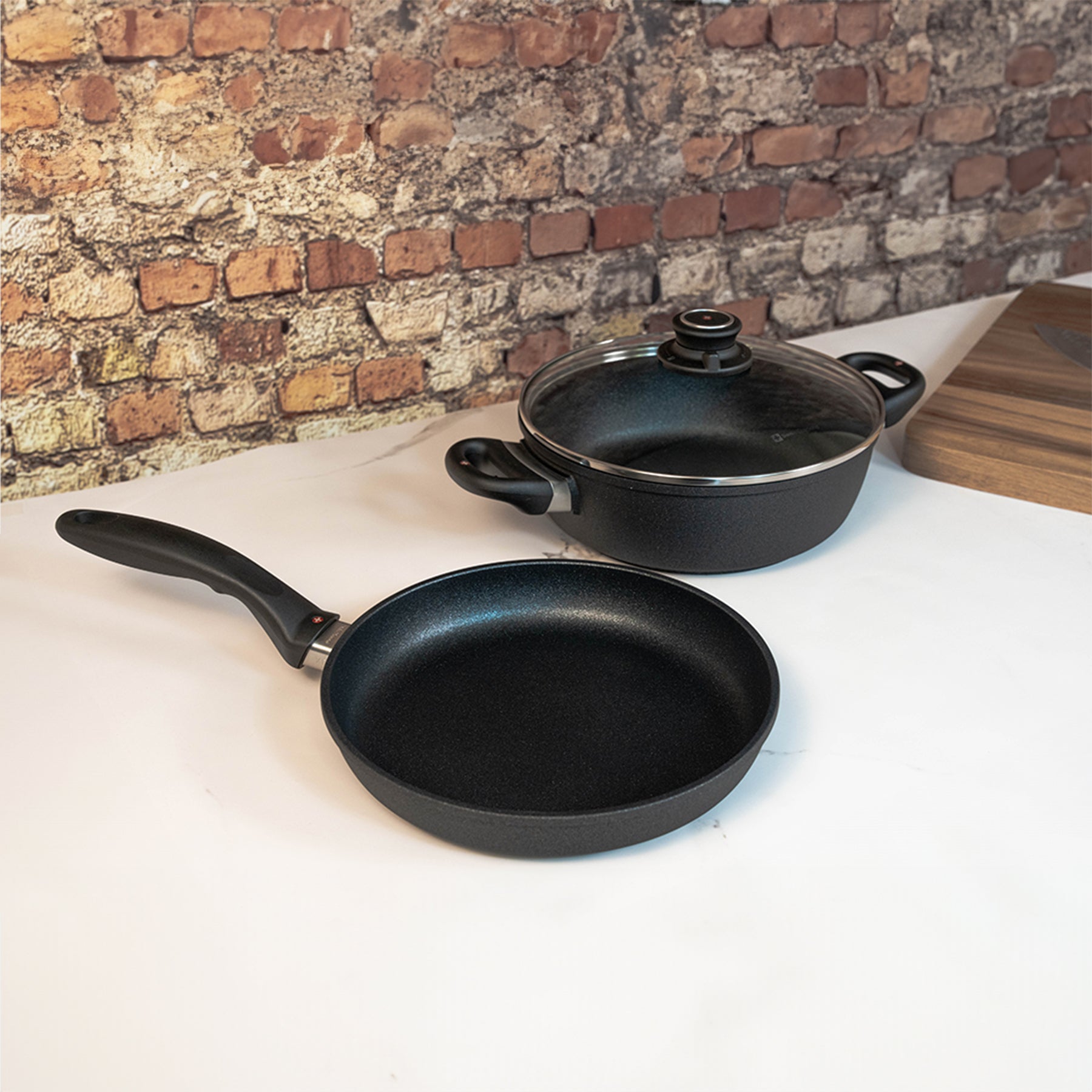 XD Nonstick 3-Piece Set - Fry Pan & Casserole on kitchen counter next to cutting board