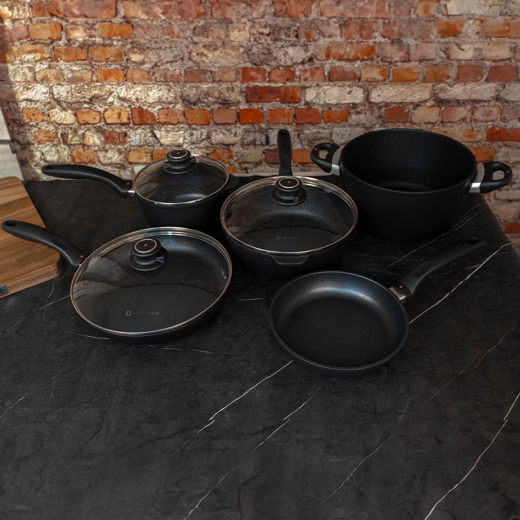 XD Nonstick 9-Piece Set - Kitchen Essentials top angled view with collection sitting on black marble counter top