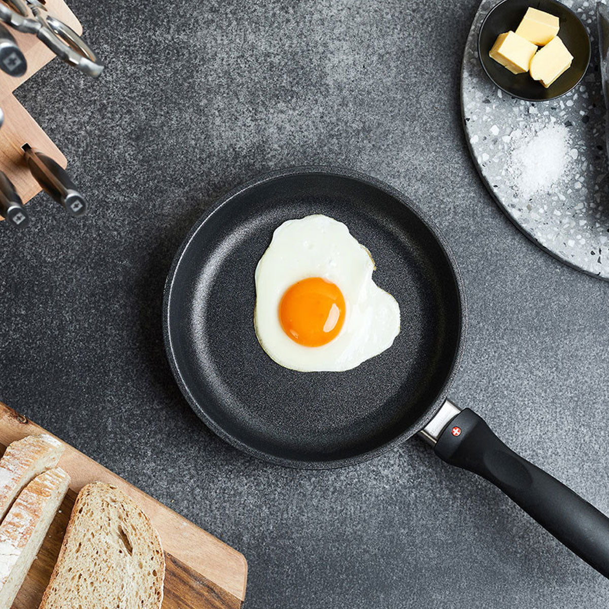 xd fry pan with a sunny side egg inside sitting on top of a kitchen counter